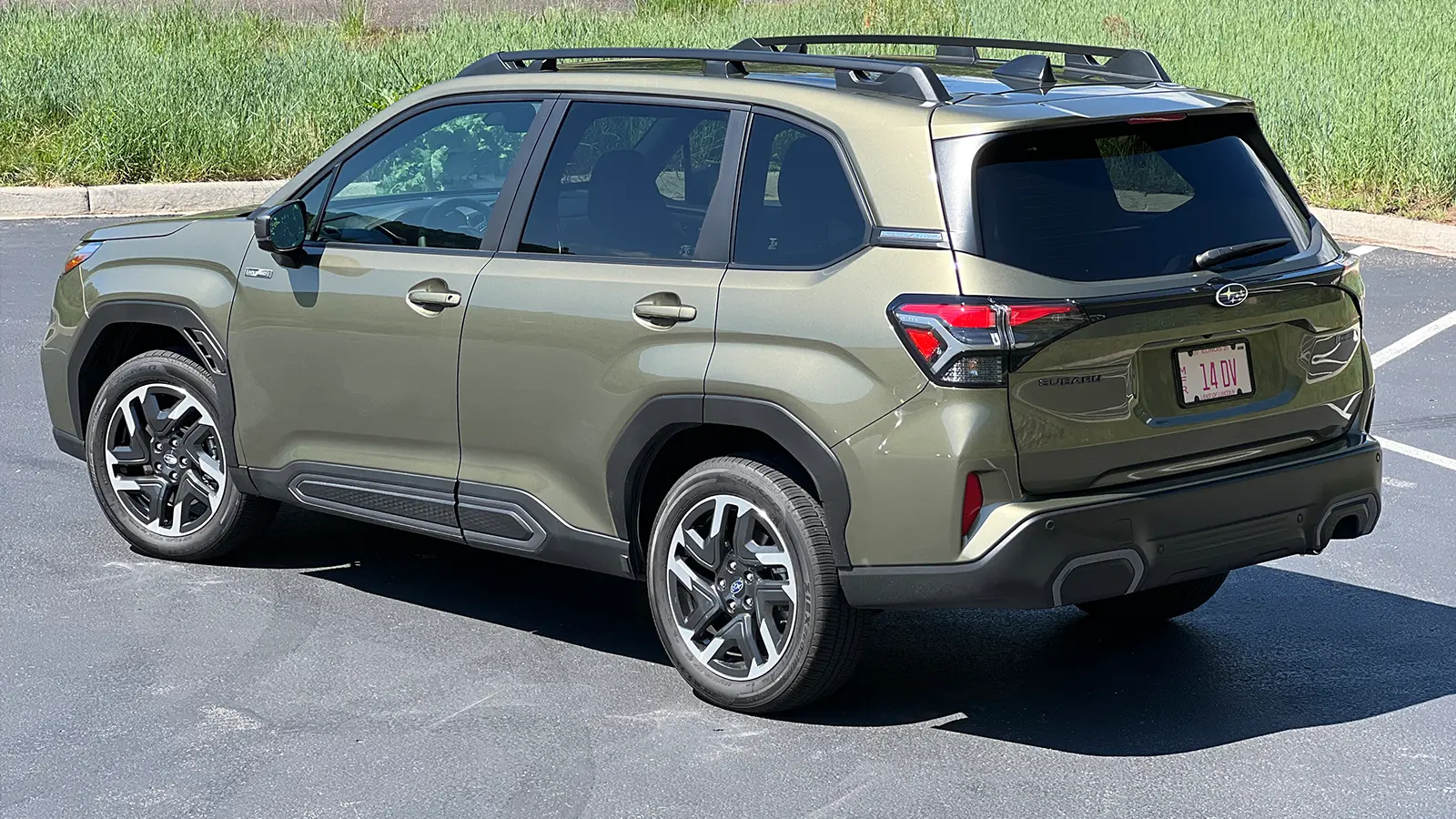 A green 2025 Subaru Forester Hybrid Review Side view