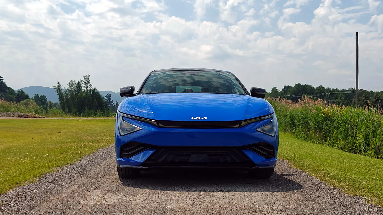 A blue Kia EV6 GT review front profile