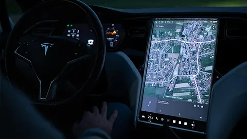 EV dashboard in an tesla planning a journey