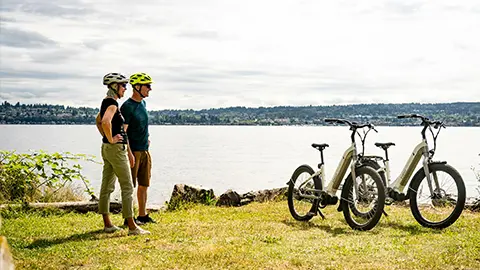 A couple looking at the view with two e-bikes