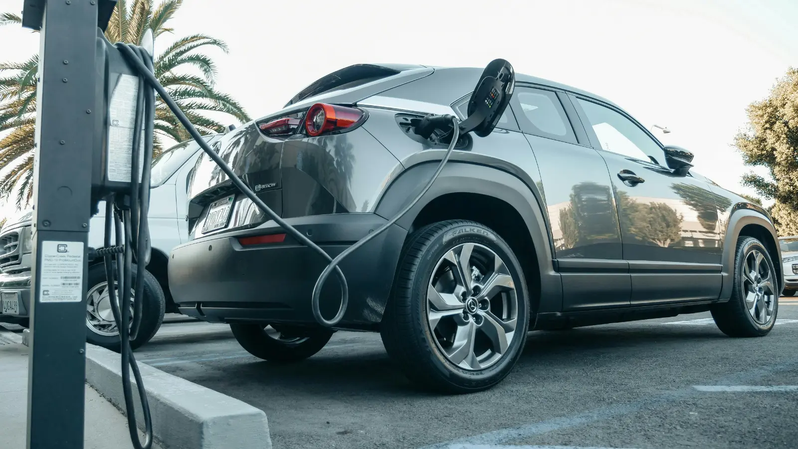 plug-in hybrid electric vehicle plugged into level 2 public charging station