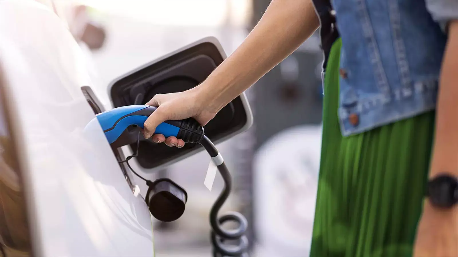 Woman charging the car