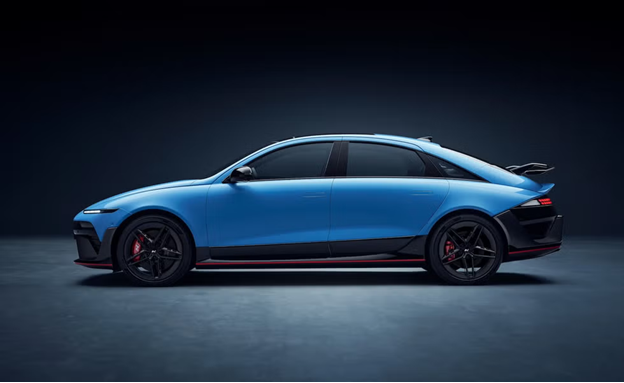 A blue car parked on a concrete surface