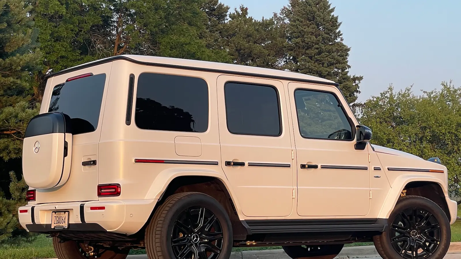A white 2025 Mercedes Benz G 580 side view