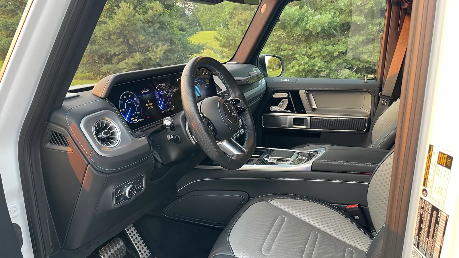 A white 2025 Mercedes Benz G 580 drivers view