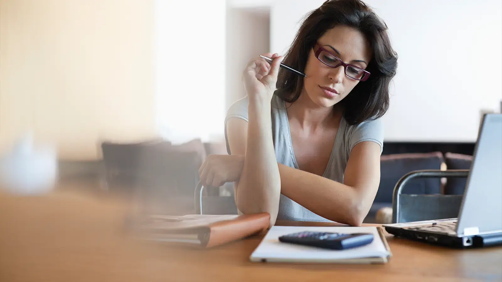 A woman using a calculator