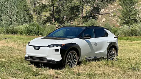 A white 2025 Subaru front view in a field