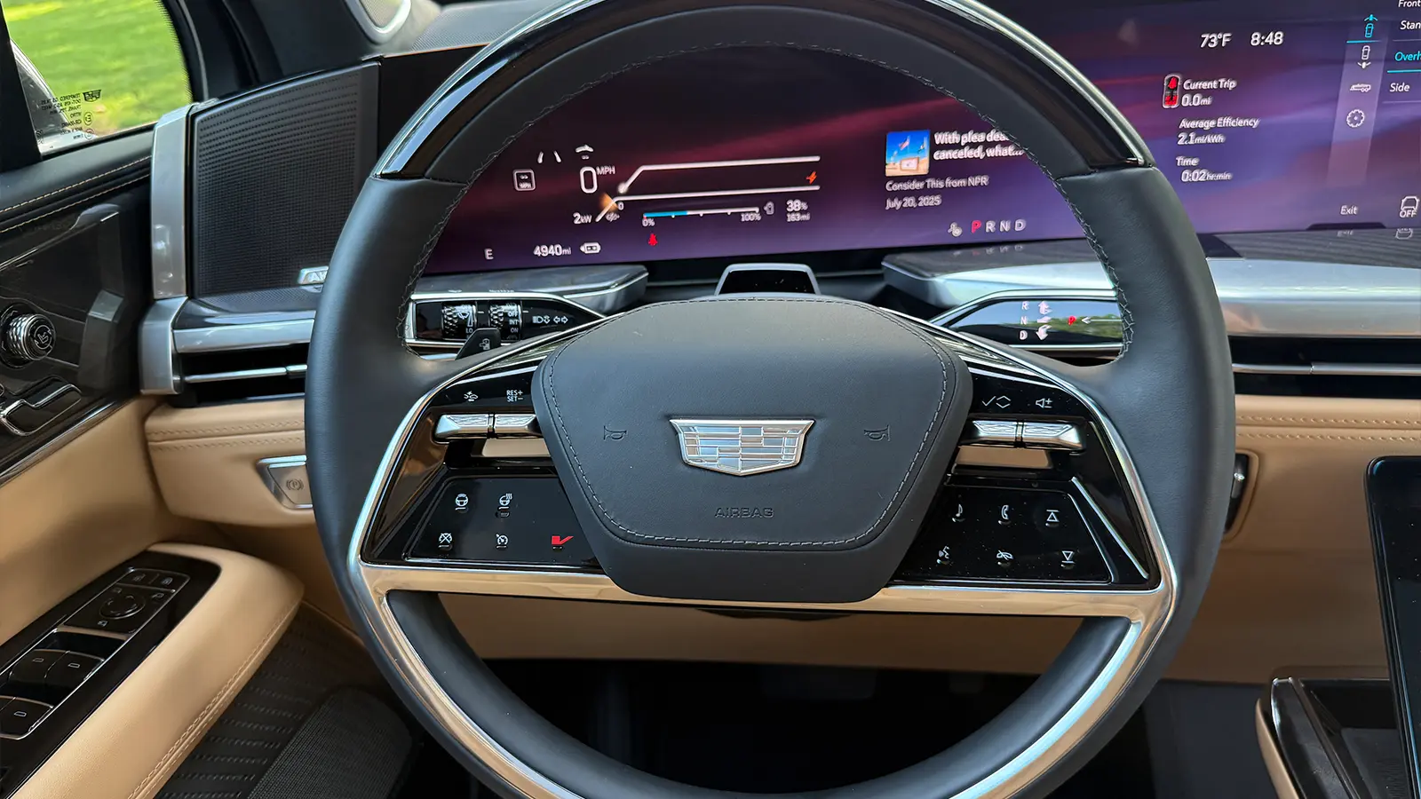 A light blue 2025 Cadillac Escalade IQ drivers view