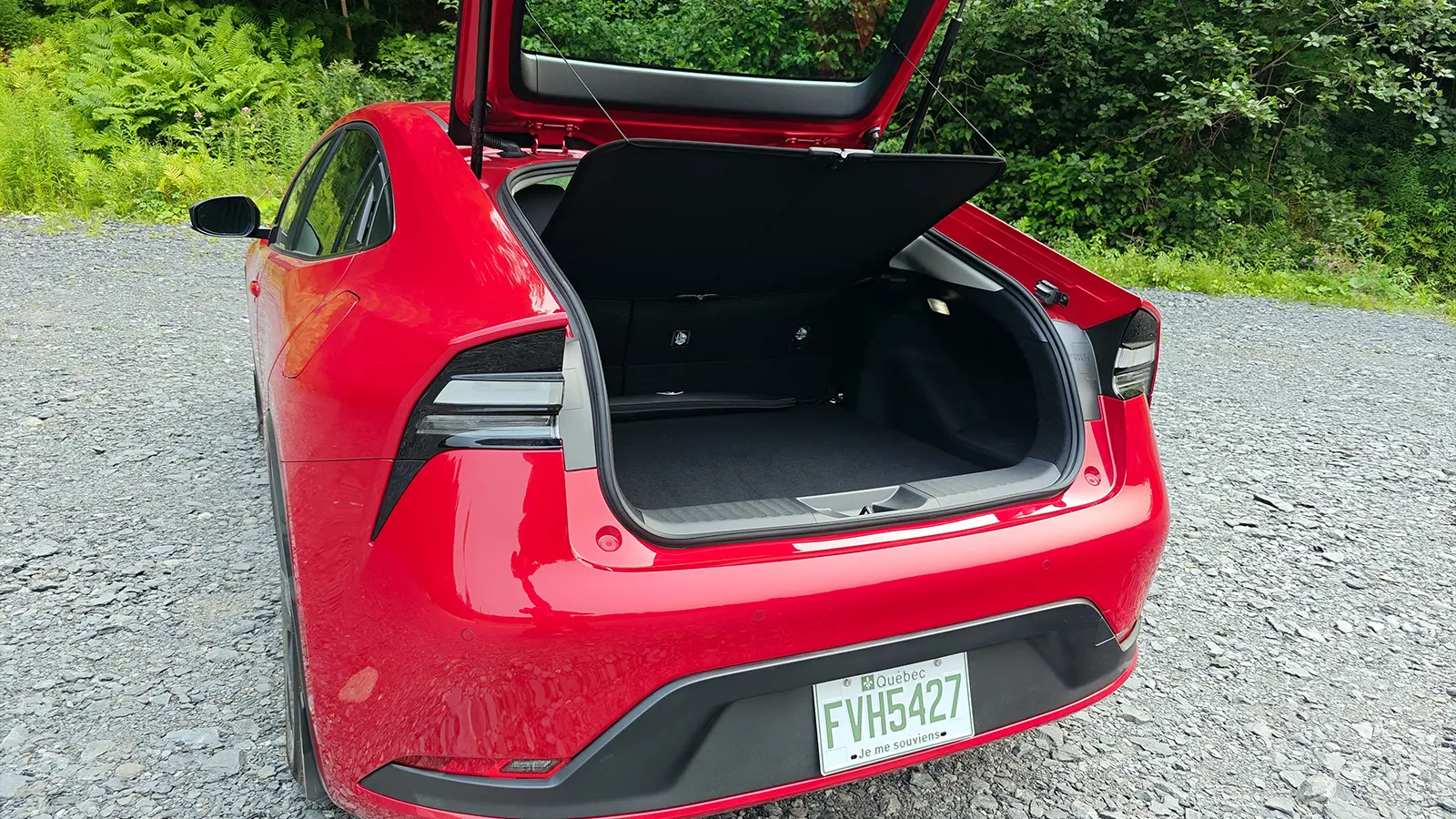 A Red 2026 Nissan Leaf cargo view