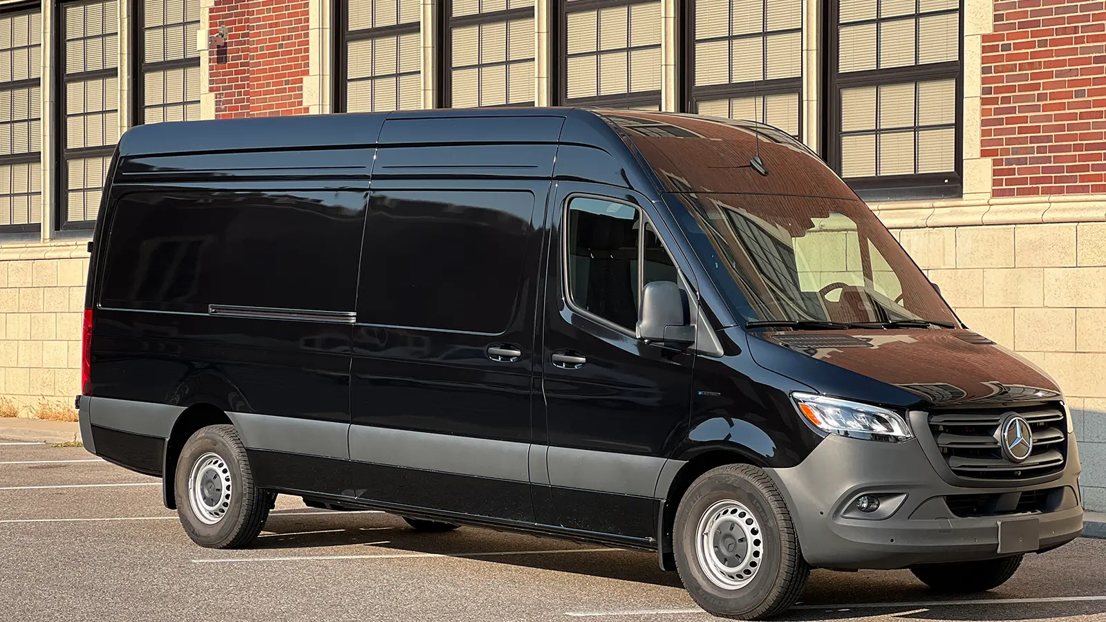 Mercedes black eSprinter parked near a building