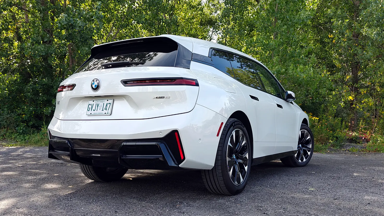 A white 2026 BMW iX xDrive60 rear view