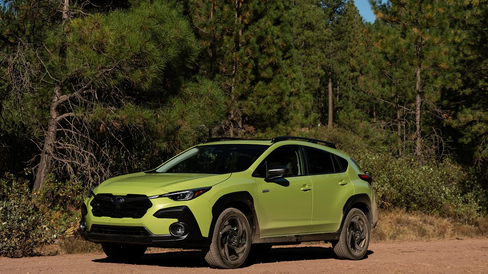 A green 2026 Subaru Crosstrek Hybrid side view