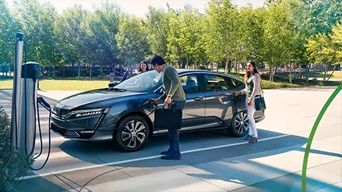 A family charging a Honda Plug-in Hybrid