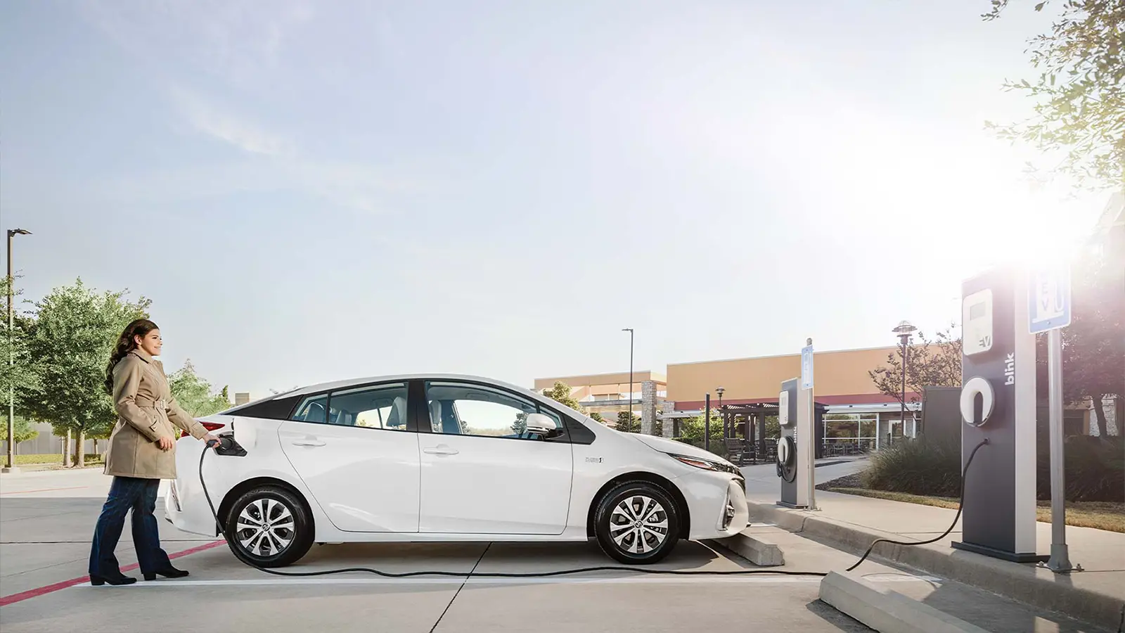 Women charging vehicle