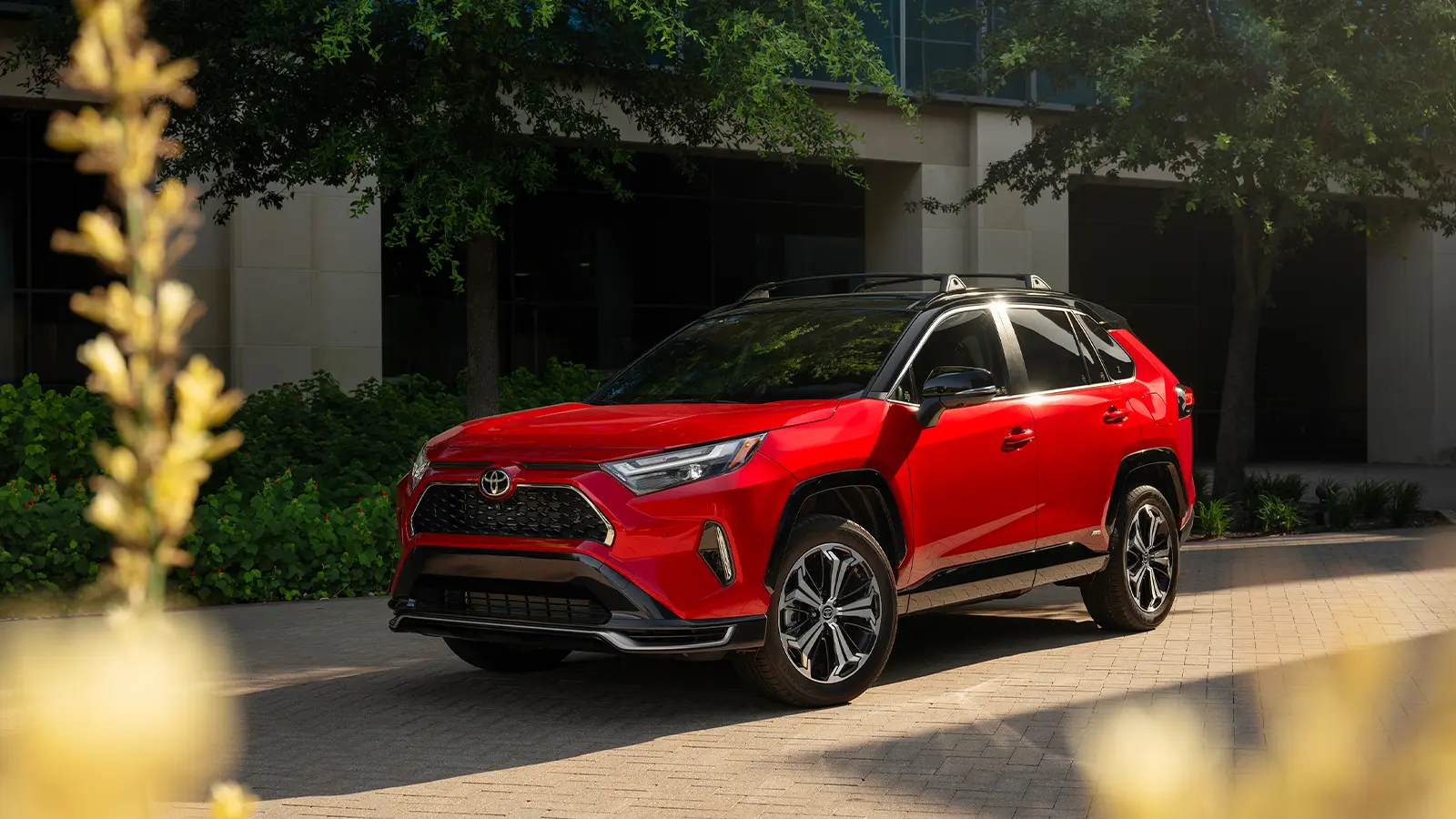 A red 2025 Toyota RAV4 PHE
