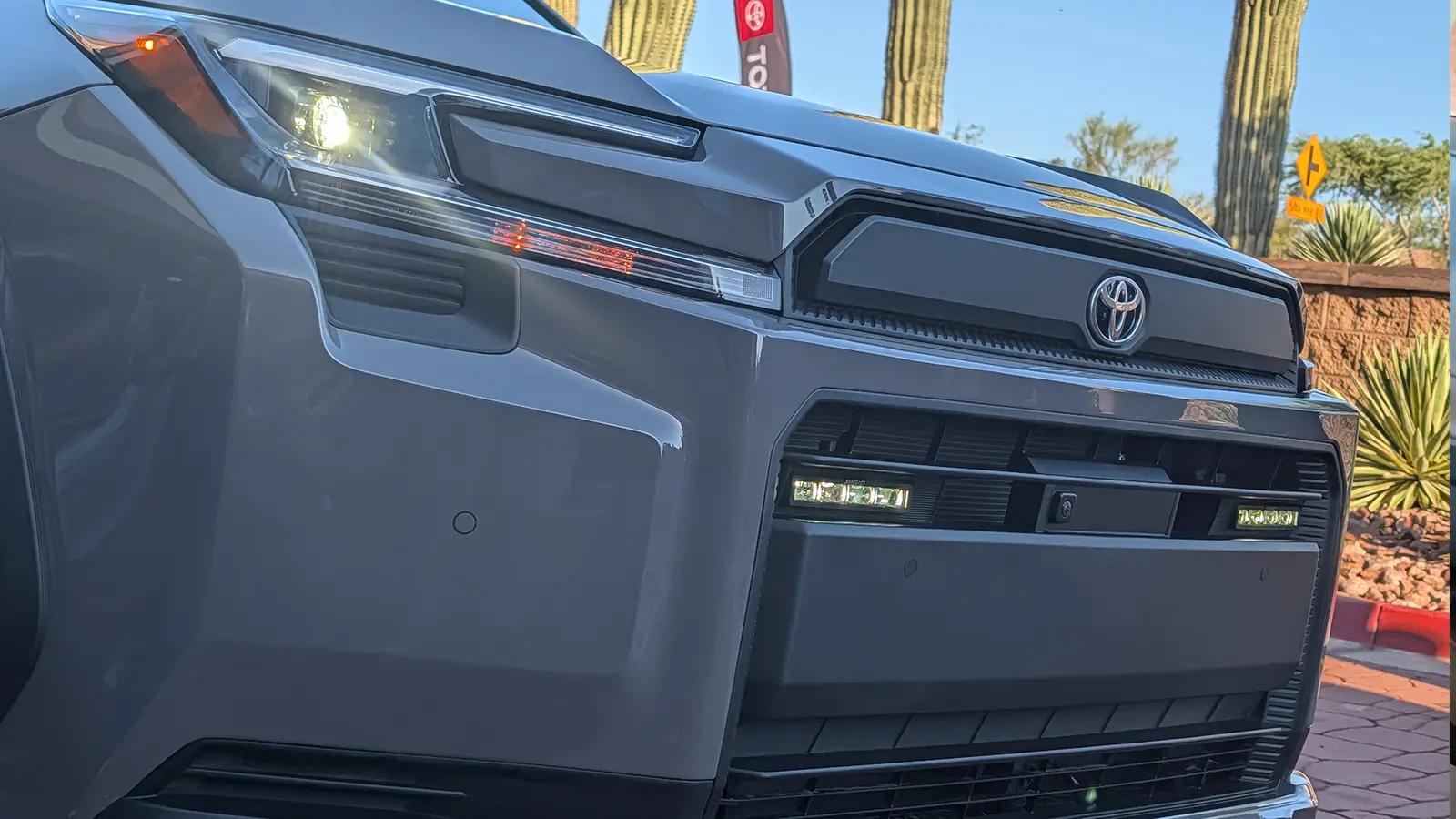 A gray 2026 Toyota Rav4 hybrid front view in the desert