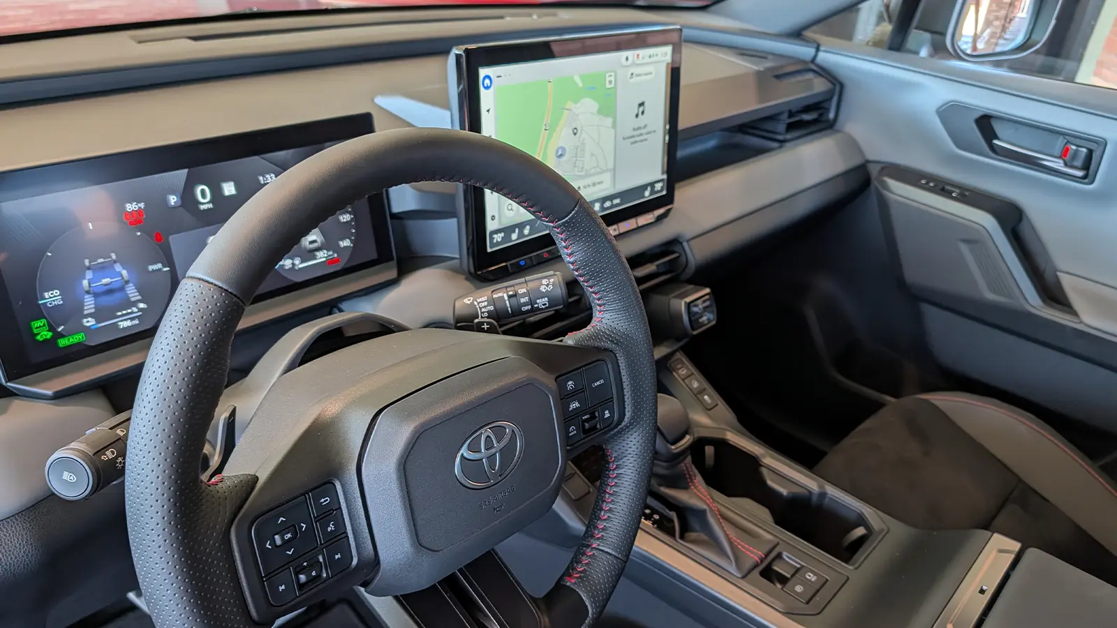 A gray 2026 Toyota Rav4 hybrid driver cockpit view