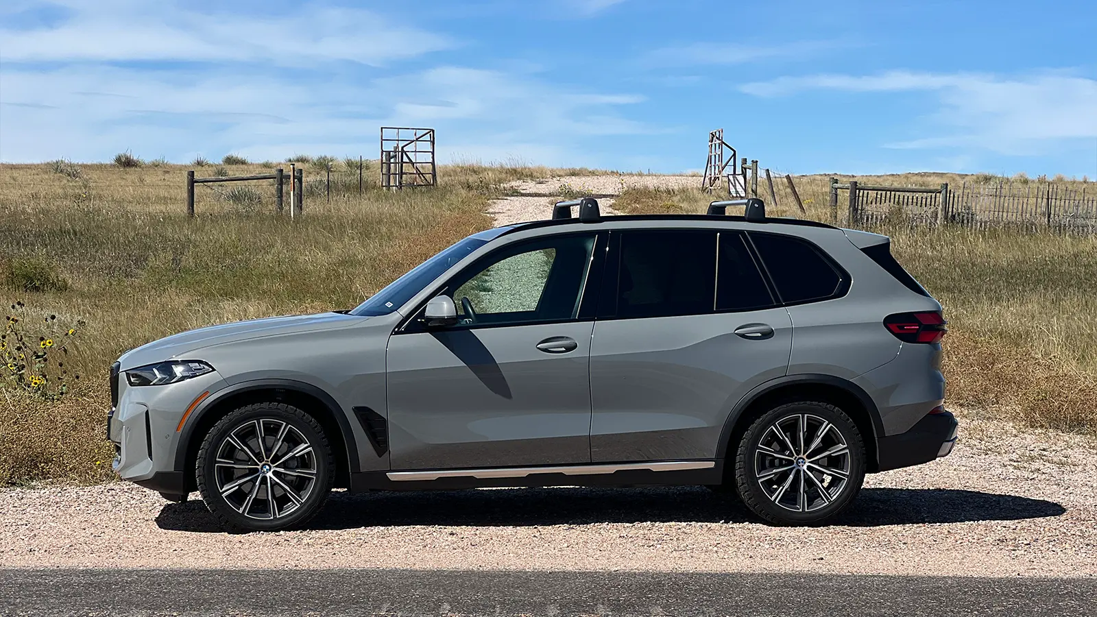 A grey 2025 BMW X5 side view