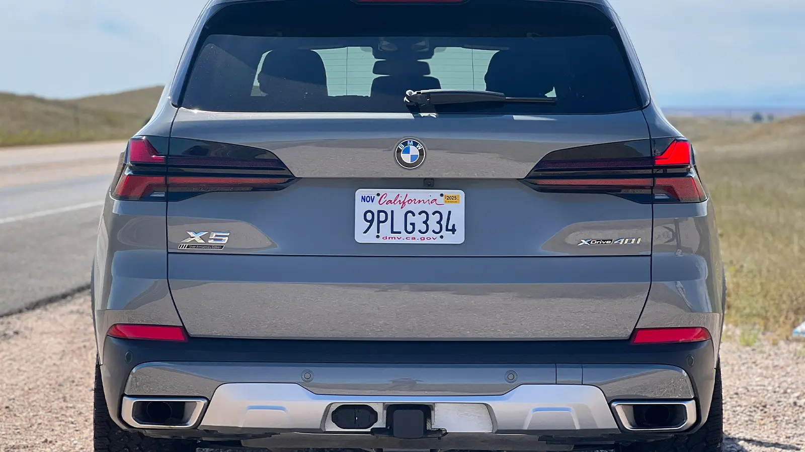A grey 2025 BMW X5 rear view