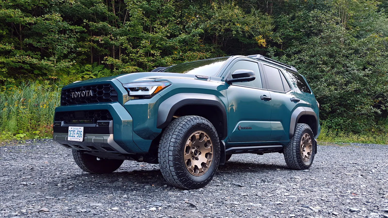 A blue 2025 Toyota 4Runner Trailhunter in the forest