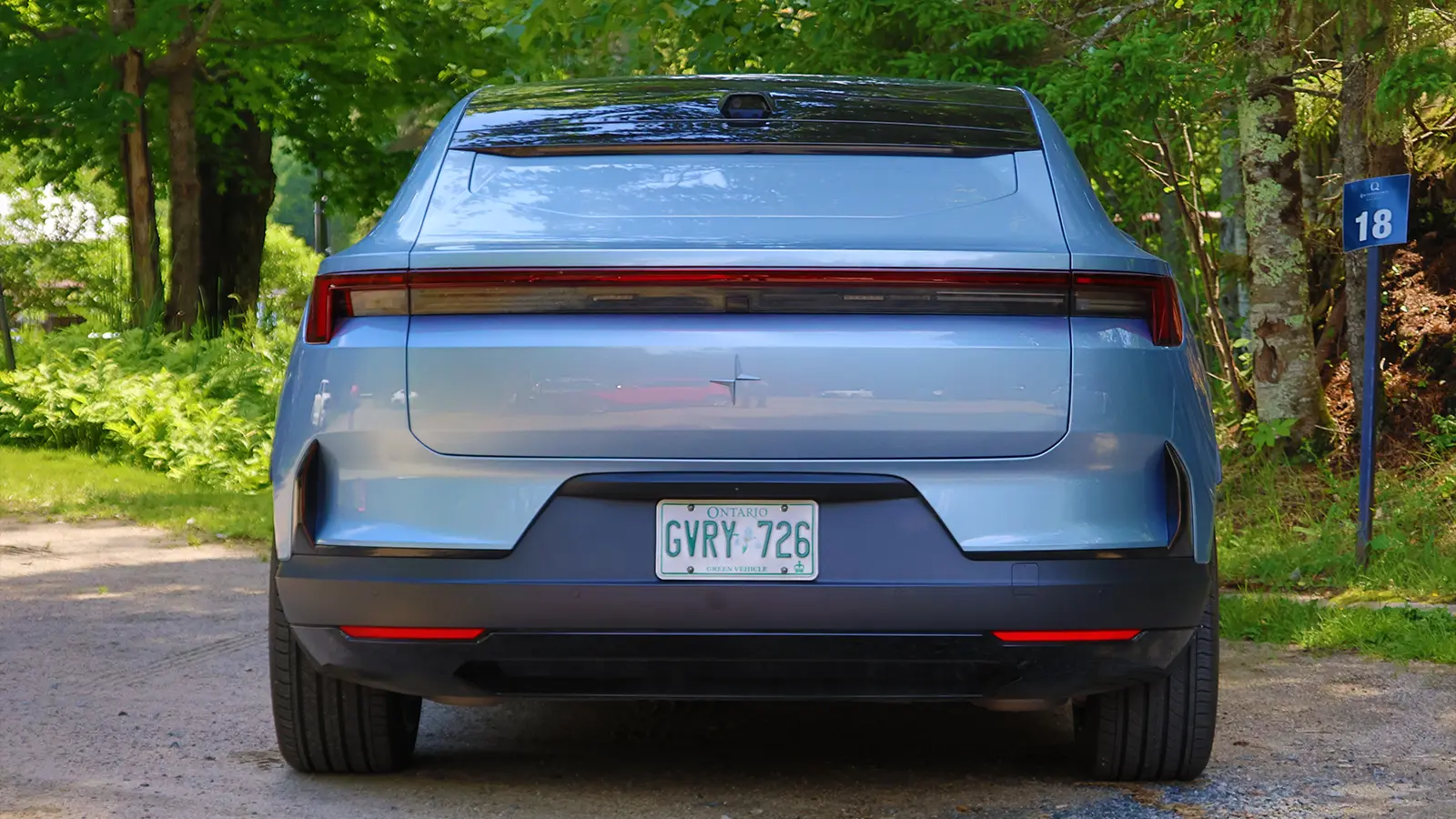 A silver 2025 Polestar 4 rear view