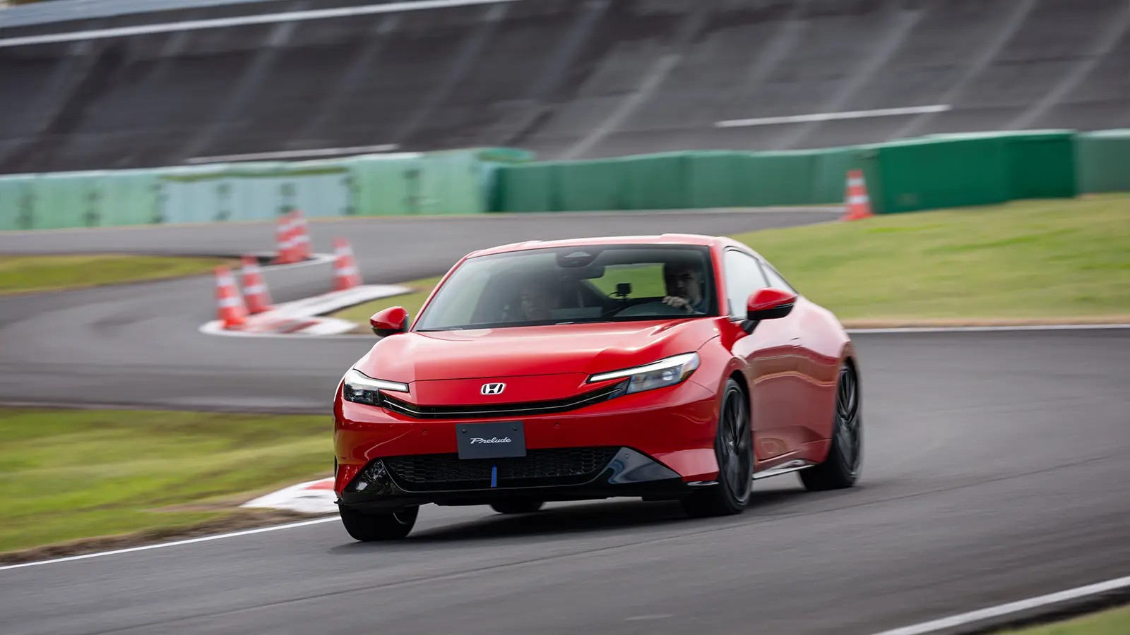 A red 2026 Honda Prelude on the track