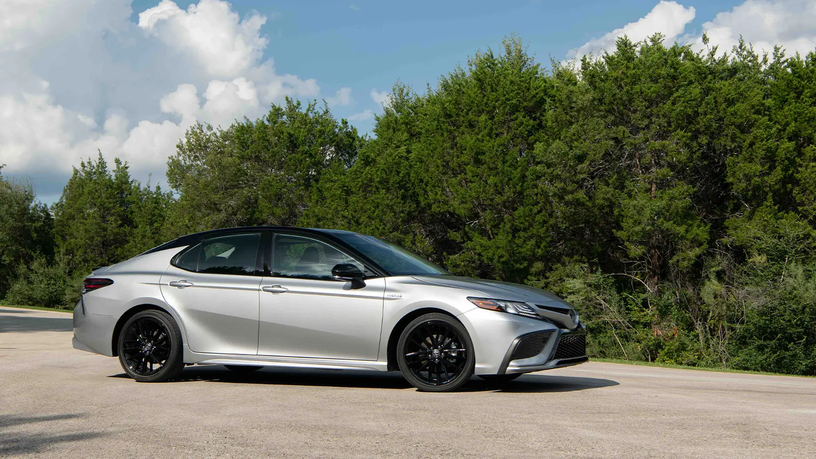 A silver 2022 Toyota Camry XSE hybrid