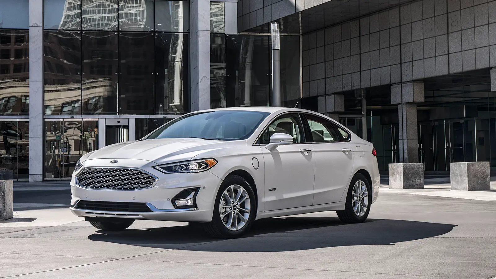 A white 2019 Ford Fusion hybrid