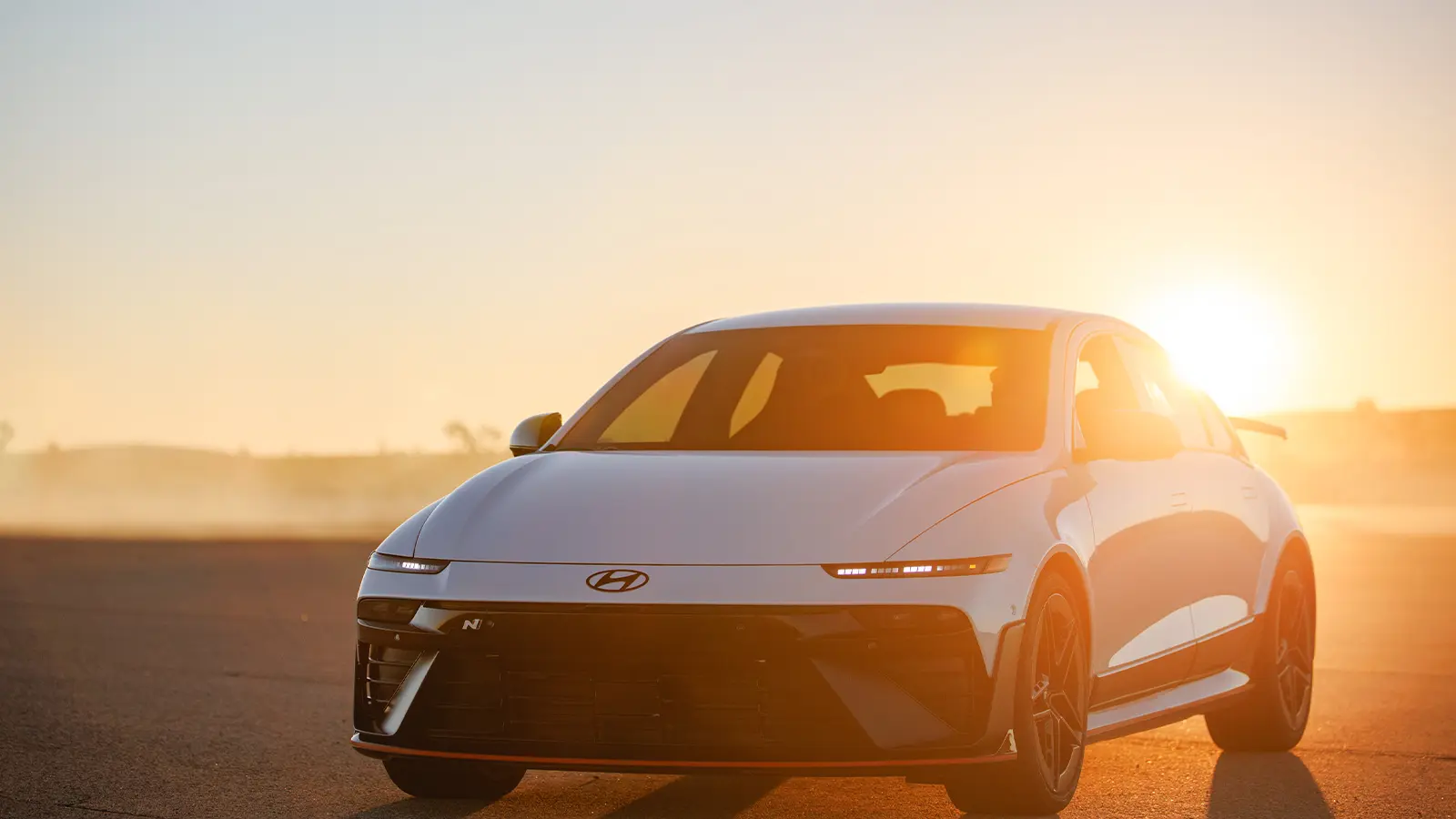 A full body view of a white 2026 Hyundai Ioniq 6 N in beautiful sunlight front view