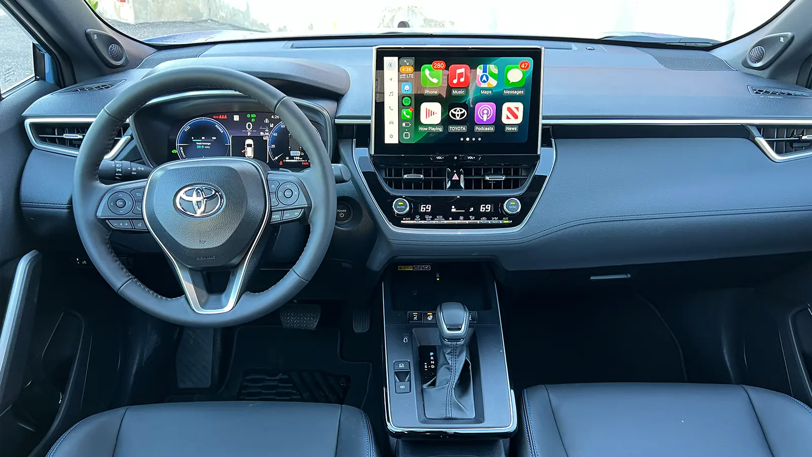 A blue 2026 Toyota Corolla Cross hybrid front view