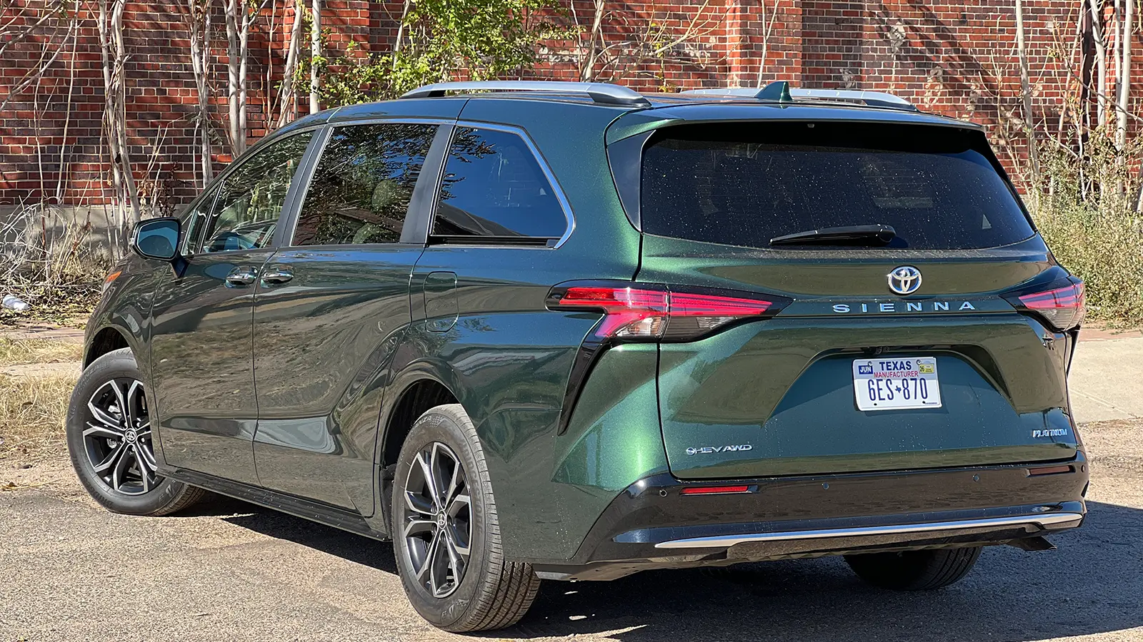 A green 2025 Toyota Sienna Hybrid Platinum AWD side view