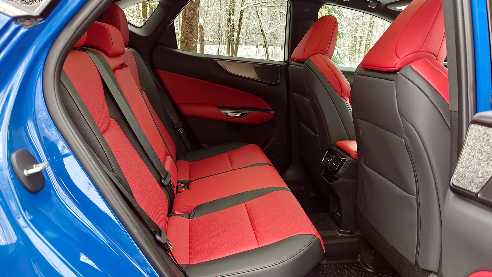 A blue 2026 Lexus NX 350h F Sport rear seat view