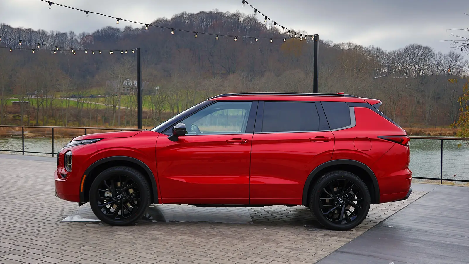 A red 2026 Nissan Rogue side view