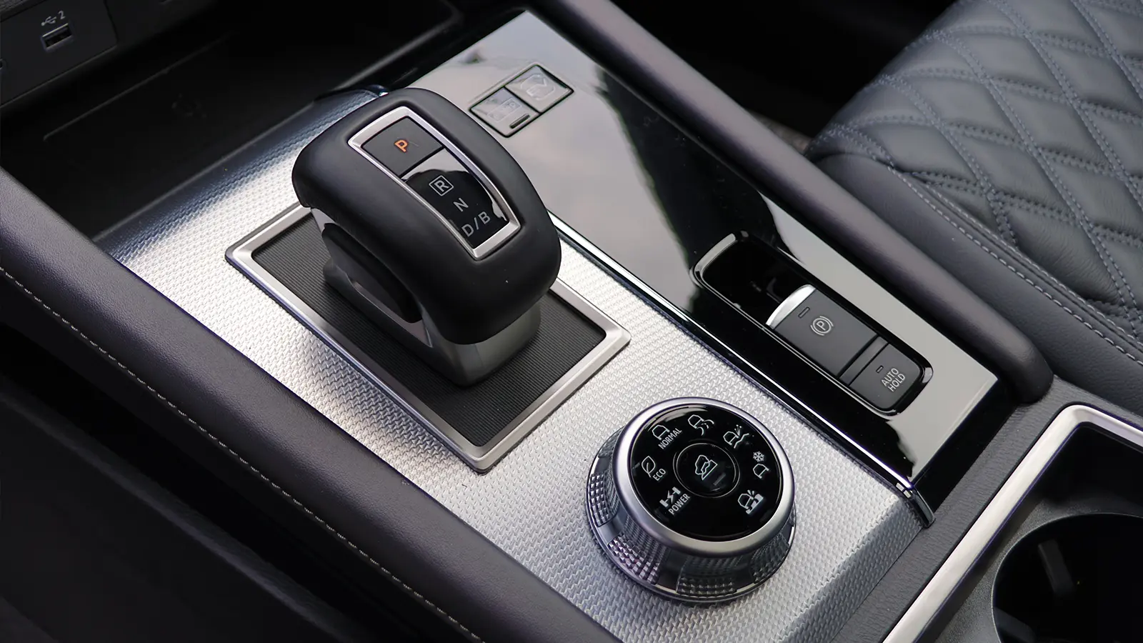 A red 2026 Nissan Rogue center console