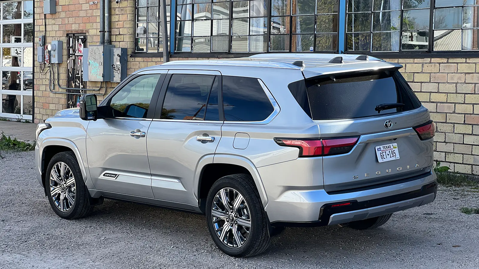 A silver 2026 Toyota Sequoia Hybrid Capstone 3 quarter rear view
