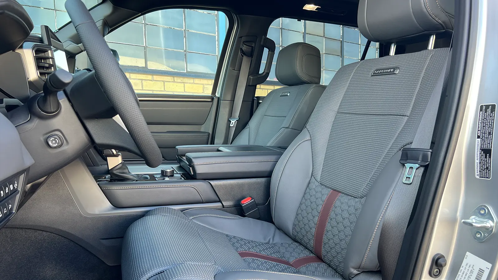 A silver 2026 Toyota Sequoia Hybrid Capstone driver side view