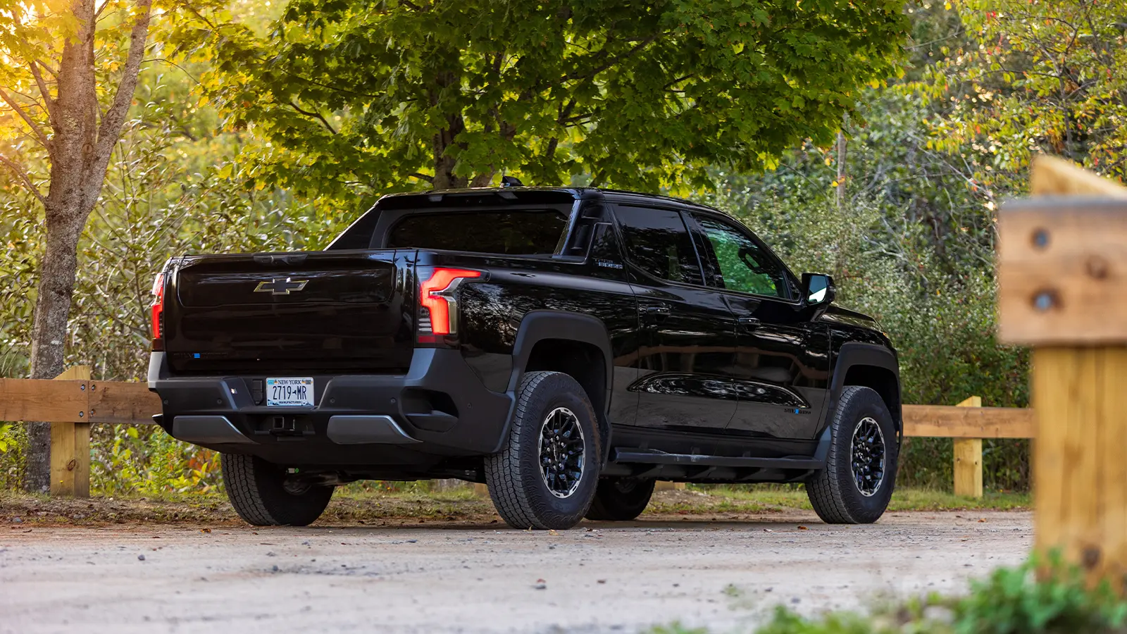 A 2026 Chevrolet Silverado EV trail boss three quarter rear view