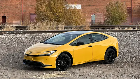 A yellow 2026 Toyota Prius XSE PHEV Nightshade