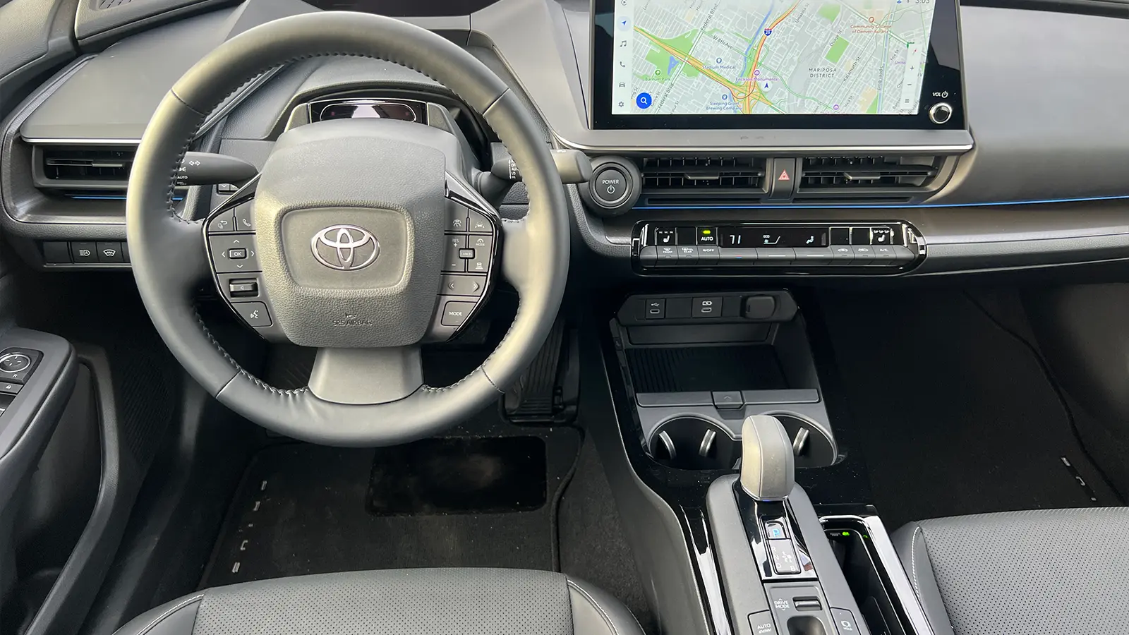 A yellow 2026 Toyota Prius XSE PHEV Nightshade driver front view