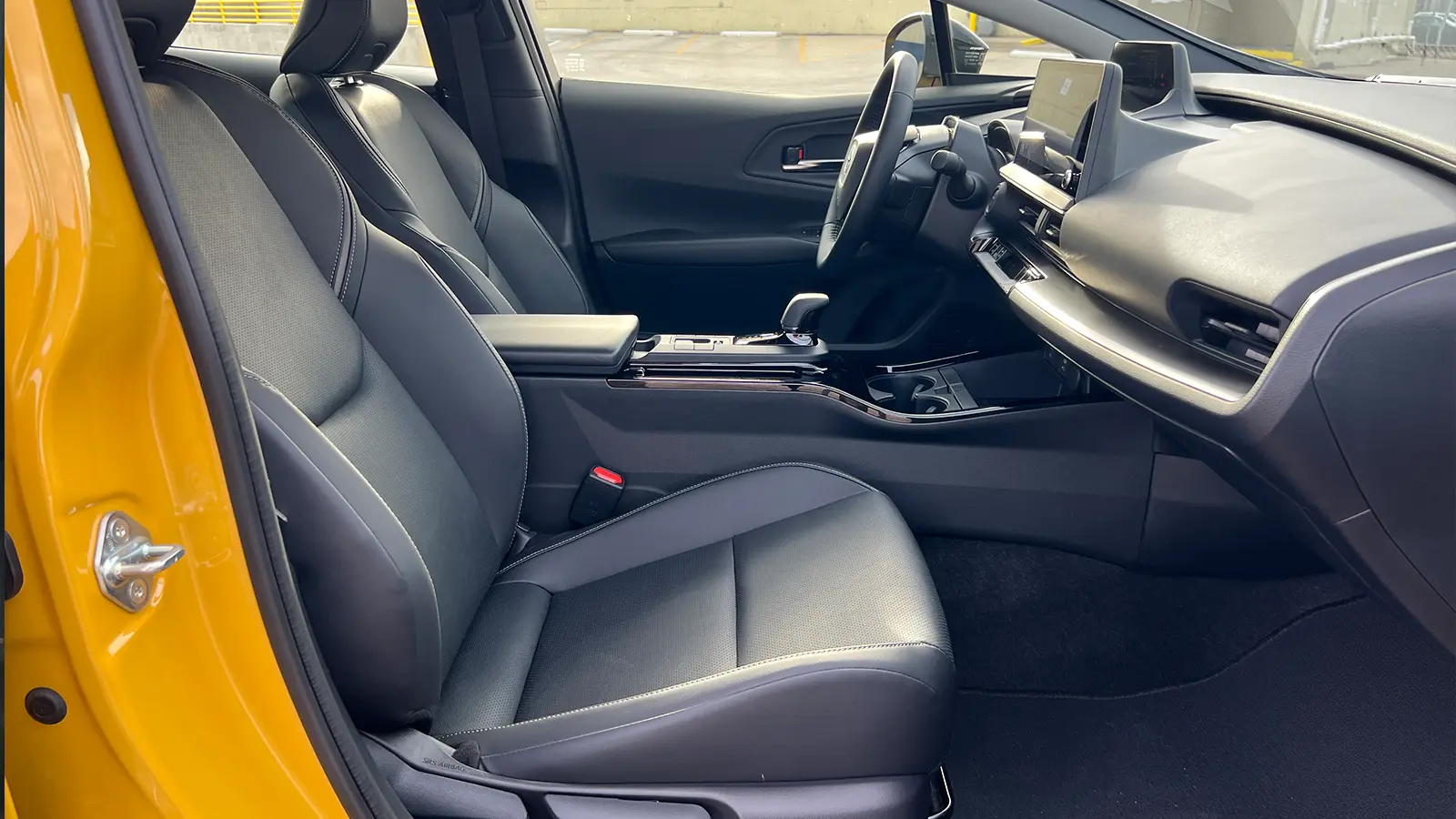 A yellow 2026 Toyota Prius XSE PHEV Nightshade driver front view