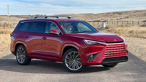 A red 2026 Lexus TX 550h+ PHEV