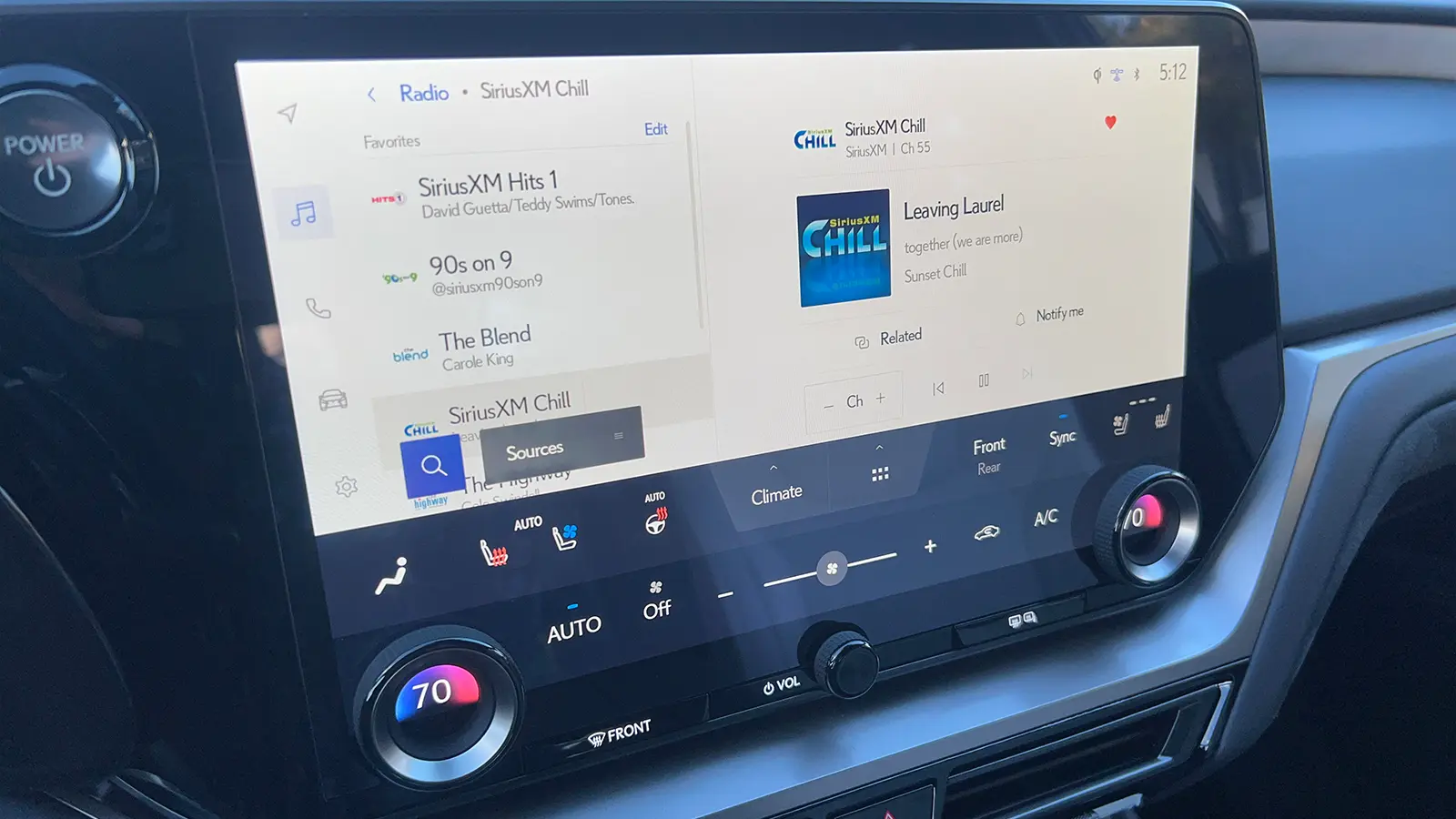 A red 2026 Lexus TX 550h+ PHEV HUD view