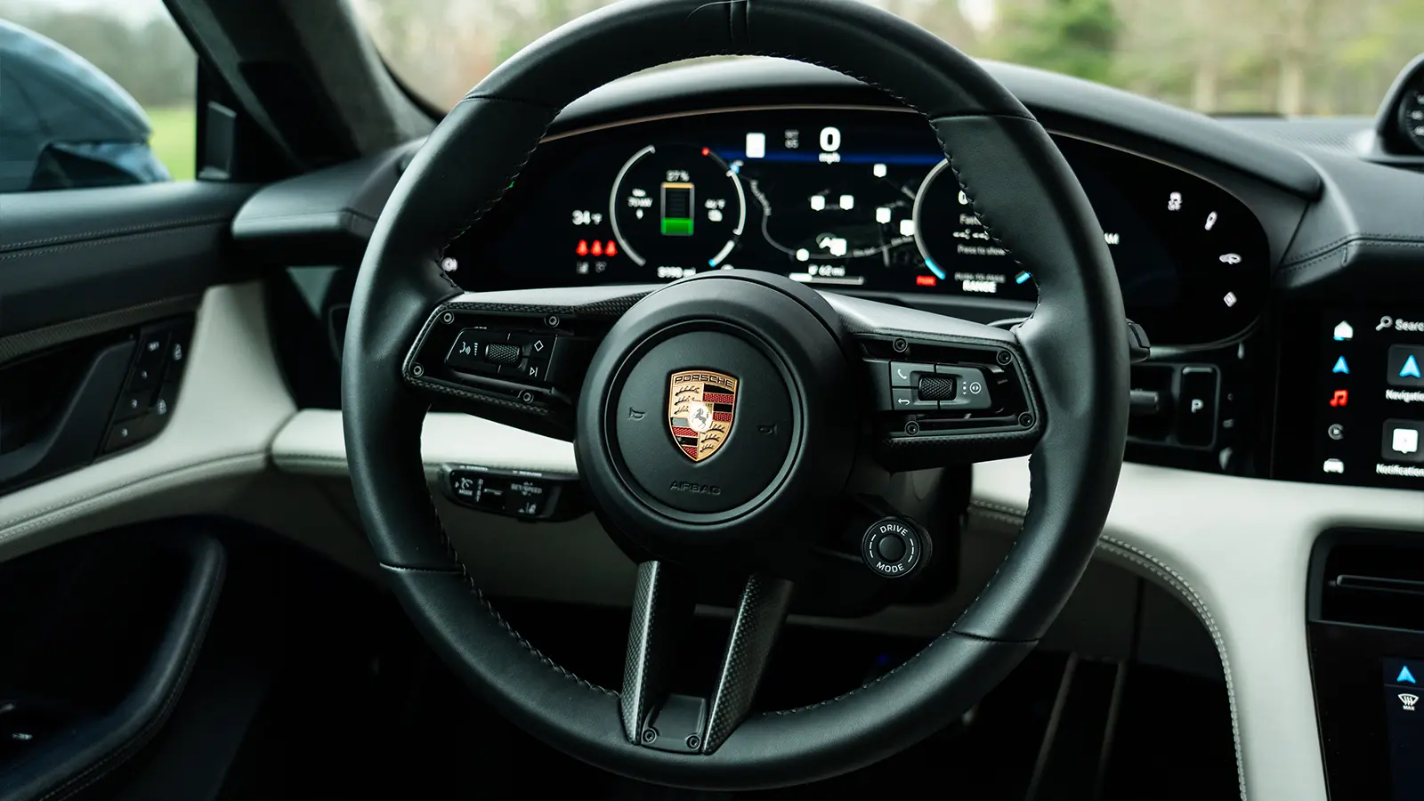 A dark gray 2025 Porsche Taycan GTS-3 driver view