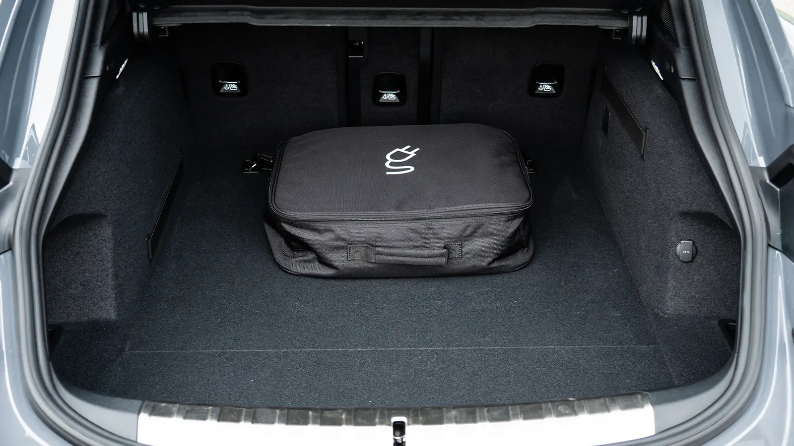 A dark gray 2025 Porsche Taycan GTS-3 rear trunk open