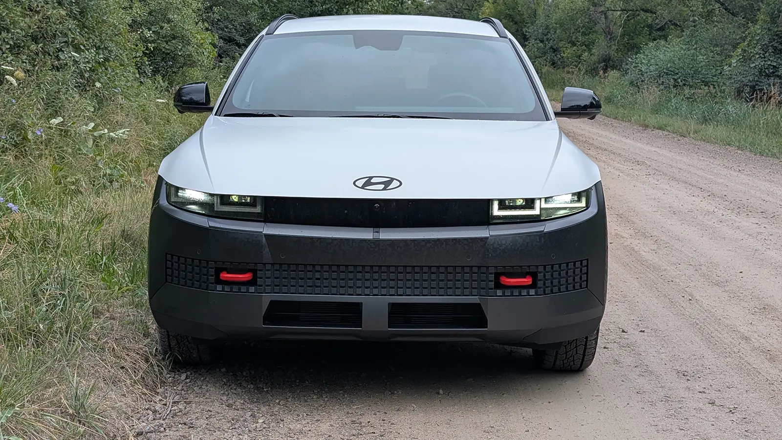 A white 2025 Hyundai 5 XRT front view off road