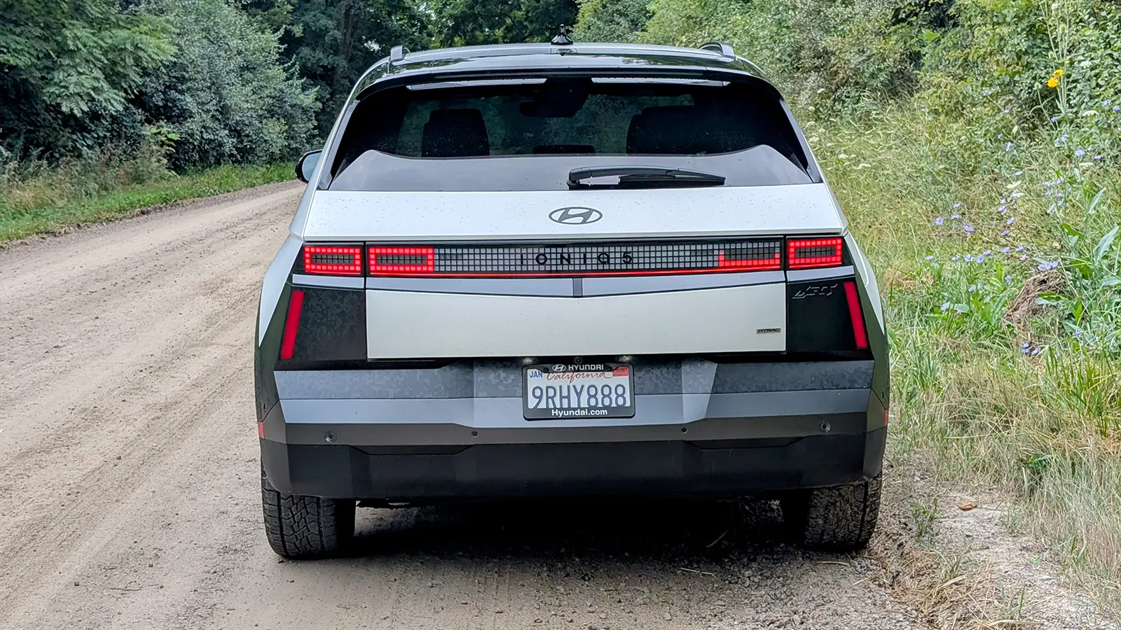 A white 2025 Hyundai 5 XRT rear view off road