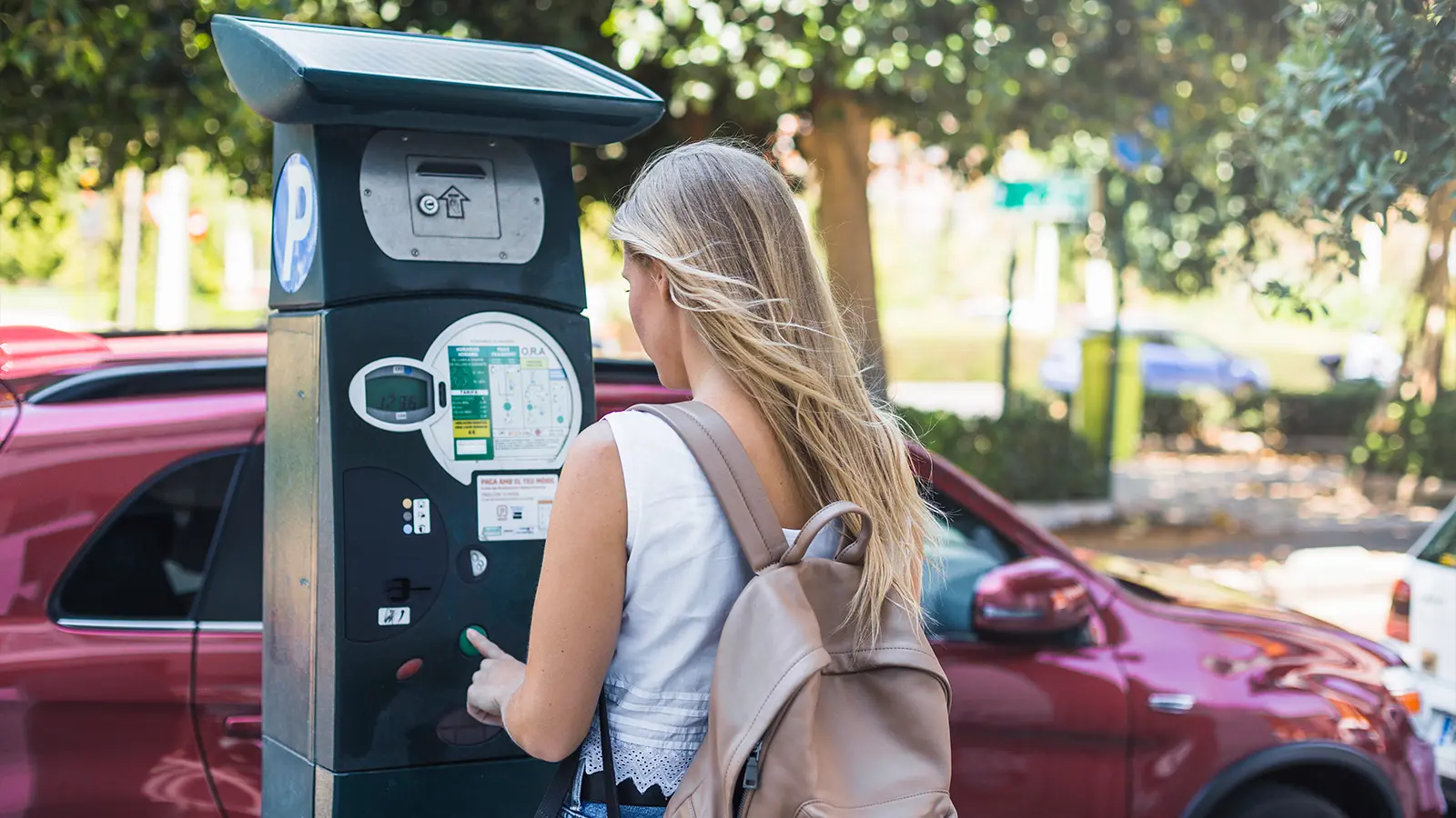 A women charging her EV