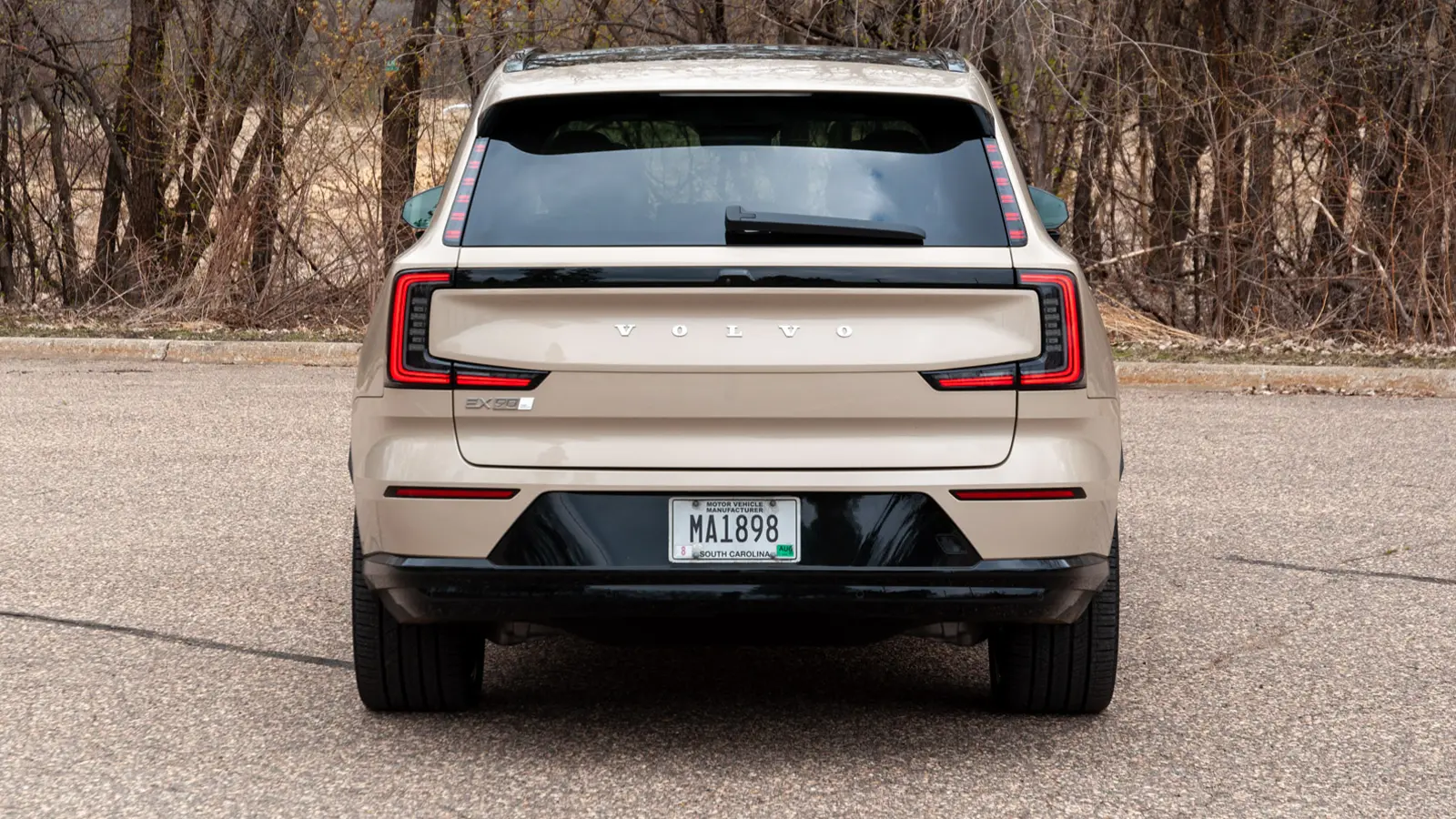 A silver 2025 Volvo EX90 rear view