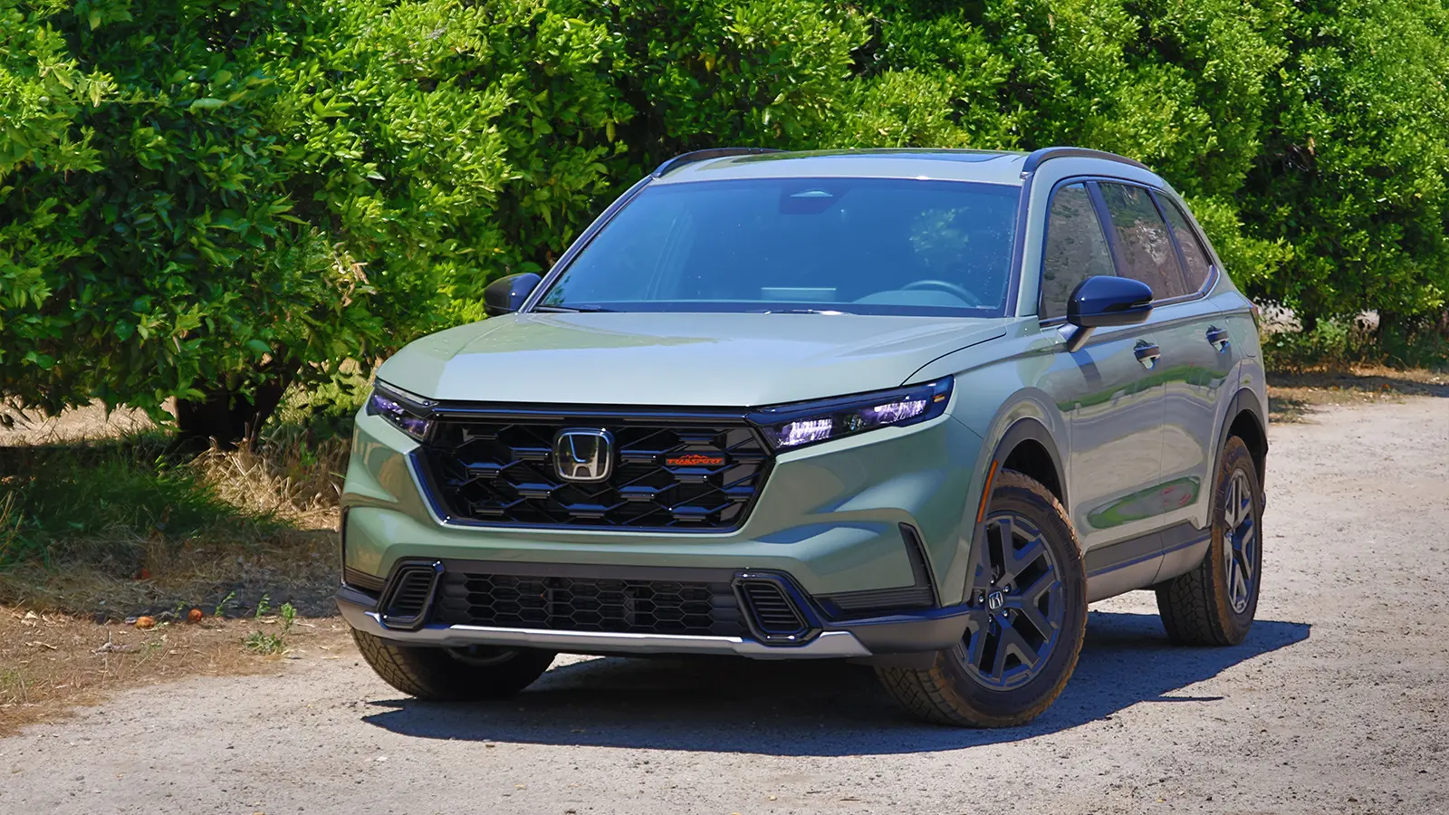 A dark green 2025 Honda CR-V hybrid three quarter front view