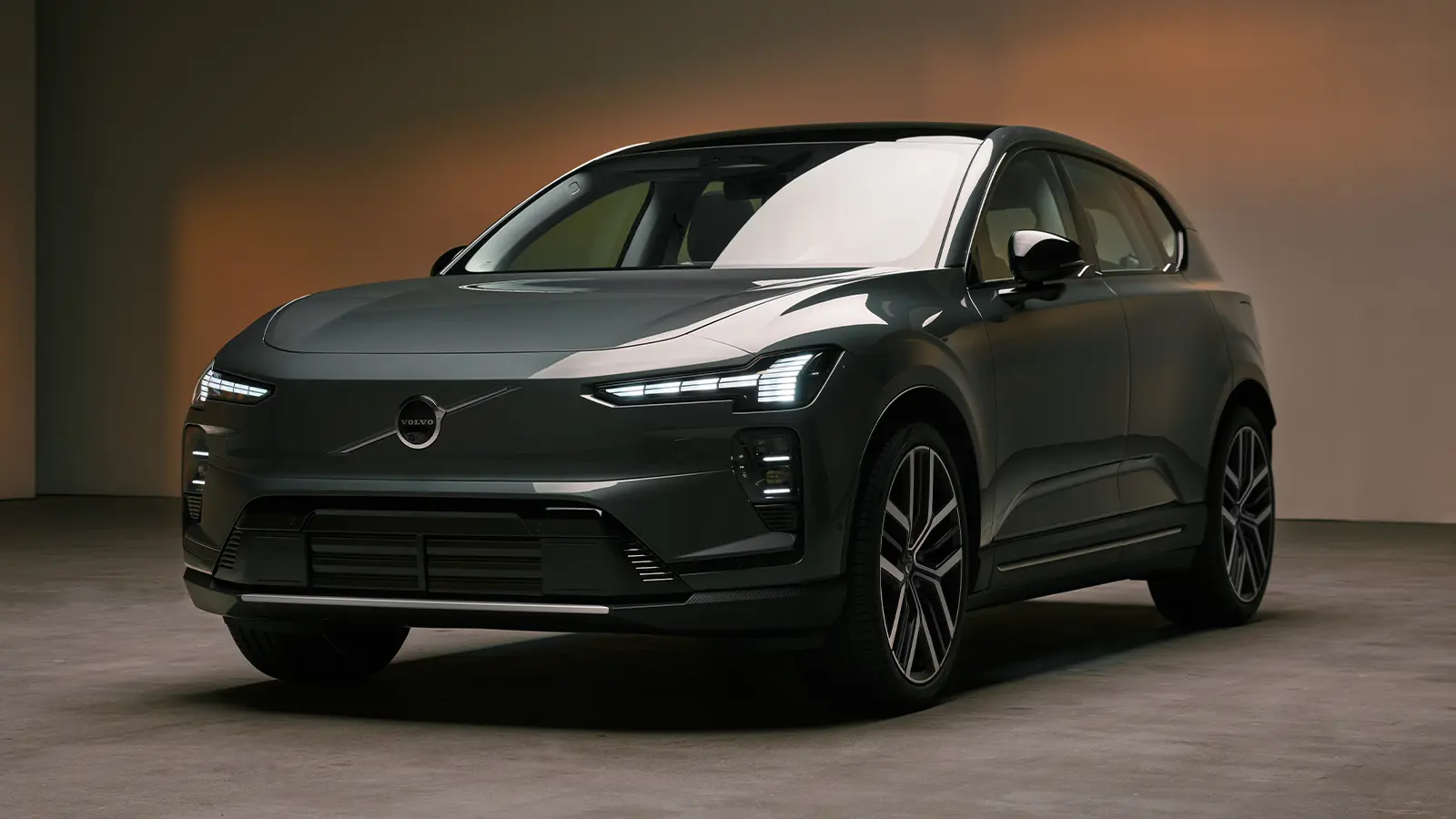 A dark gray 2027 Volvo EX60 three quarter front view